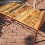recycled pallet table with wrought iron base