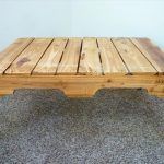 repurpsed pallet coffee table with 3 rod metal hairpin legs