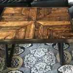 repurposed wooden pallet coffee table with metal pipe base