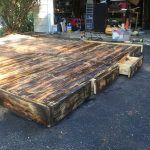 scorched pallet platform bed with drawers