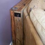 low-cost wooden pallet behind sofa table